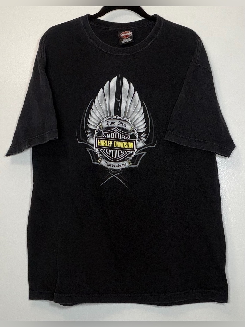 Harley-Davidson Black Tee with Silver Wing Logo and Yellow Badge